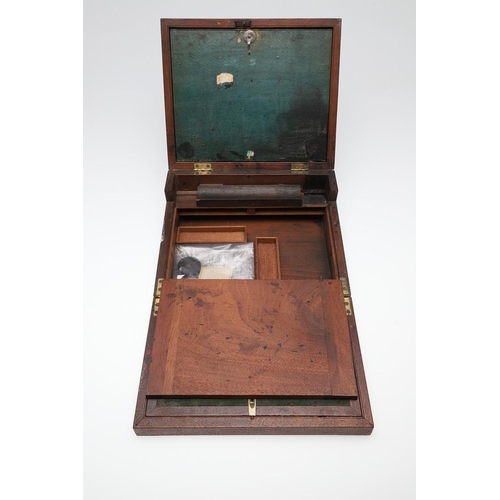 1494 - A 19TH CENTURY MAHOGANY AND BRASS BOUND WRITING SLOPE. in the Campaign style with recessed side hand... 