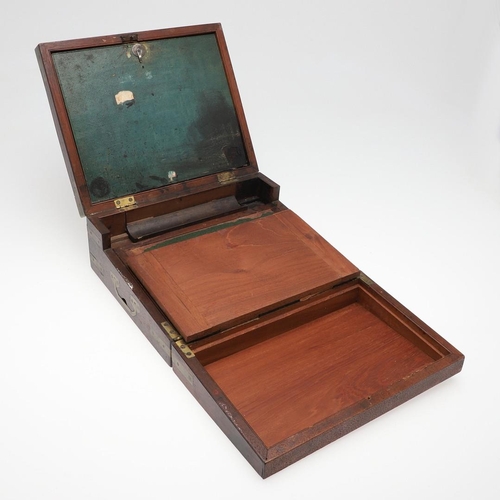 1494 - A 19TH CENTURY MAHOGANY AND BRASS BOUND WRITING SLOPE. in the Campaign style with recessed side hand... 