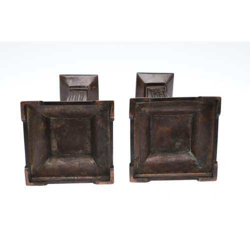 1495 - A PAIR OF ARCHITECTURAL COPPER CANDLESTICKS. the square sconces to fluted columns and flared bases, ... 