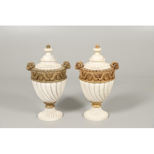 1496 - A PAIR OF REGENCY STYLE RESIN URNS AND COVERS. the lobed bodies with gold painted swag and acanthus ... 