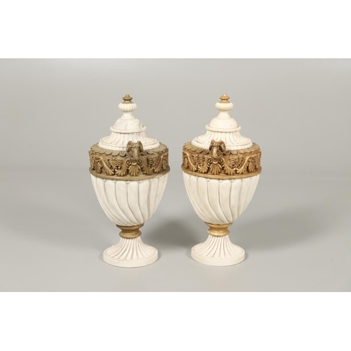 1496 - A PAIR OF REGENCY STYLE RESIN URNS AND COVERS. the lobed bodies with gold painted swag and acanthus ... 