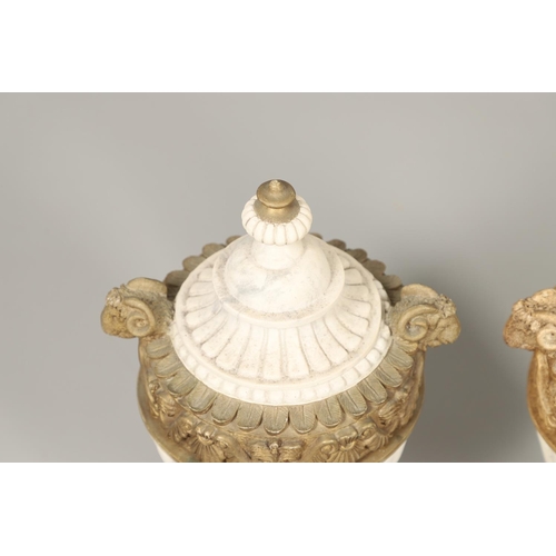 1496 - A PAIR OF REGENCY STYLE RESIN URNS AND COVERS. the lobed bodies with gold painted swag and acanthus ... 