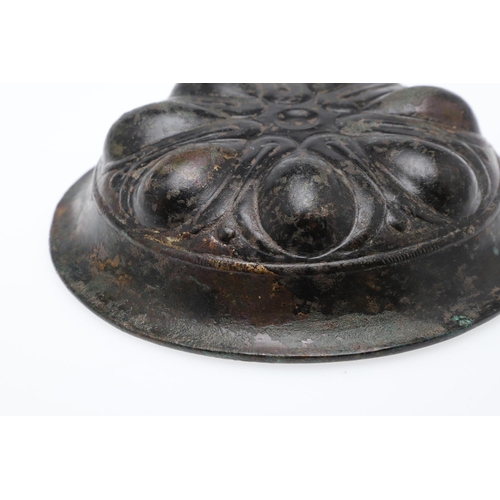 1500 - A GREEK BRONZE PHIALE. with a broad rim and seven almond shaped impressions arranged around a centra... 