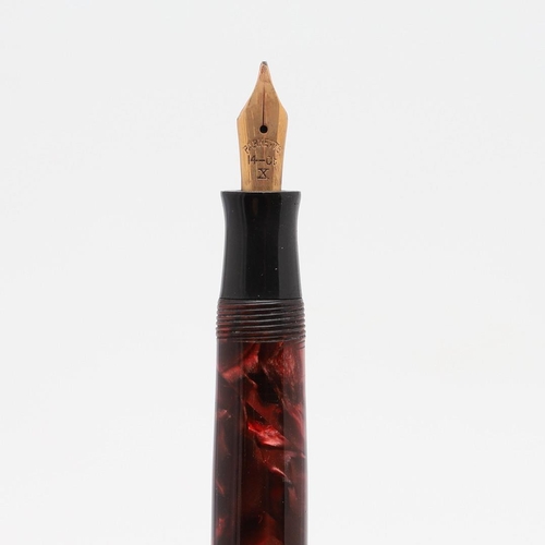 1517 - A PARKETTE LEVERFILL FOUNTAIN PEN. in pink marbled resin with two narrow bands to cap, the nib marke... 