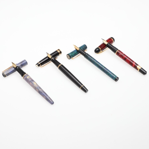 1519 - A GROUP OF WATERMAN FOUNTAIN PENS. comprising a Phileas red marbled bodied pen, a 1990s purple feath... 