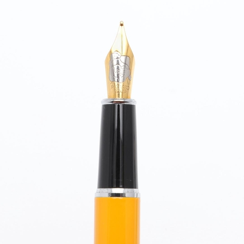 1520 - PICASSO: TWO CONTEMPORARY FOUNTAIN PENS. the yellow cased pen with 22k nib, the black cased pen with... 