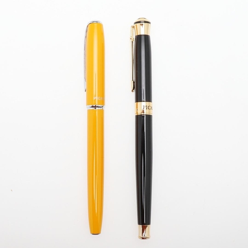 1520 - PICASSO: TWO CONTEMPORARY FOUNTAIN PENS. the yellow cased pen with 22k nib, the black cased pen with... 