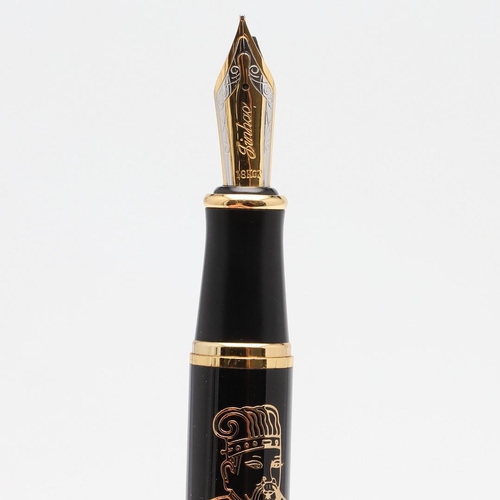 1522 - JINHAO: FOUR FOUNTAIN PENS. comprising a black barrelled example with a Chinese figure of a wise man... 