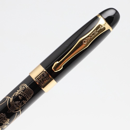 1522 - JINHAO: FOUR FOUNTAIN PENS. comprising a black barrelled example with a Chinese figure of a wise man... 