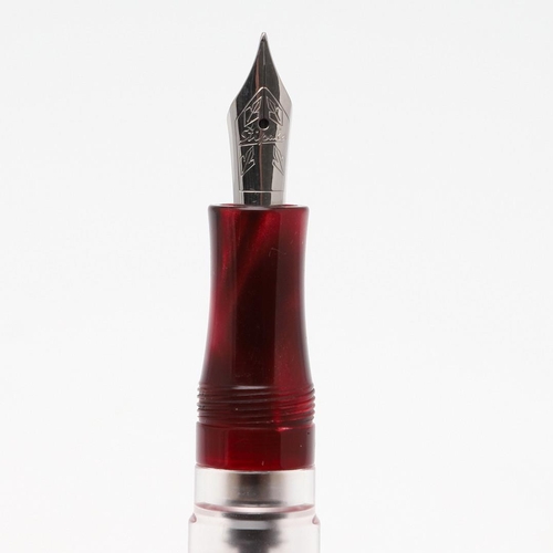 1525 - A STIPULA FOUNTAIN PEN. with ruby pink celluloid body, white metal clip and leaf emblem, clear ink r... 