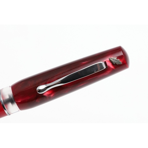 1525 - A STIPULA FOUNTAIN PEN. with ruby pink celluloid body, white metal clip and leaf emblem, clear ink r... 