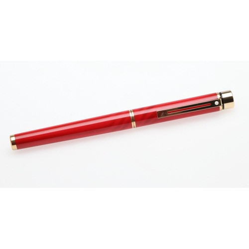 1528 - A SHEAFFER TARGA FOUNTAIN PEN. the red case with gold tone trim and white dot to cap, 14k nib; and a... 