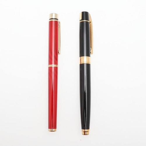 1528 - A SHEAFFER TARGA FOUNTAIN PEN. the red case with gold tone trim and white dot to cap, 14k nib; and a... 