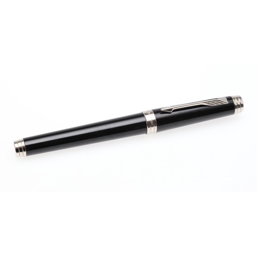 1530 - A PARKER PREMIER BLACK FOUNTAIN PEN. with black lacquer barrel and cap with chrome trim, the nib sta... 