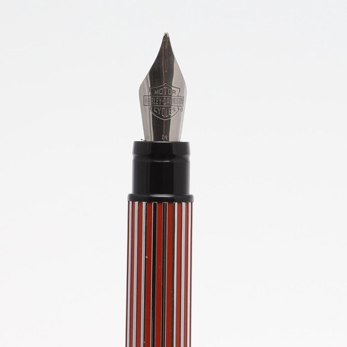 1534 - WATERMAN: TWO HARLEY DAVIDSON FOUNTAIN PENS. one with red and chrome casing, the other in chrome and... 