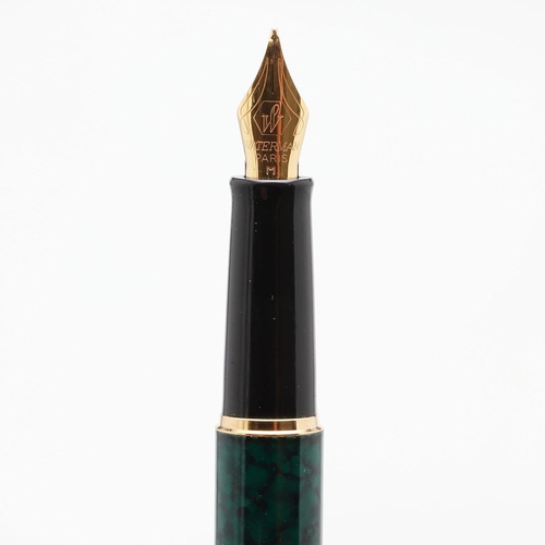 1540 - THREE WATERMAN FOUNTAIN PENS. comprising: a Hemisphere green bodied pen, a brushed steel cased pen a... 