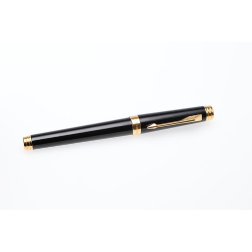 1545 - A PARKER PREMIER BLACK FOUNTAIN PEN. with black lacquer barrel and cap, gilt trim and 18k gold nib. ... 