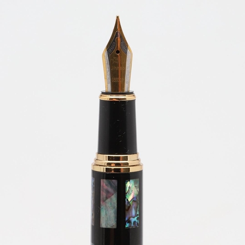 1552 - JINHAO: FOUR FOUNTAIN PENS. An abalone shell inlaid example with 18K plated nib, a wood effect barre... 