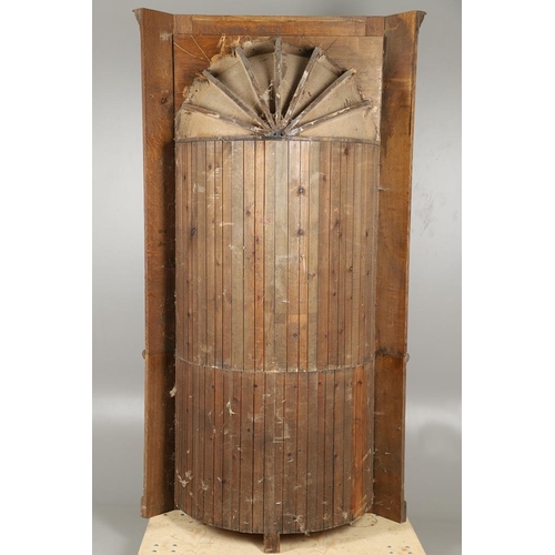 1556 - AN OAK BARREL BACK ALCOVE CUPBOARD. the upper half with Classical architectural features to three sh... 