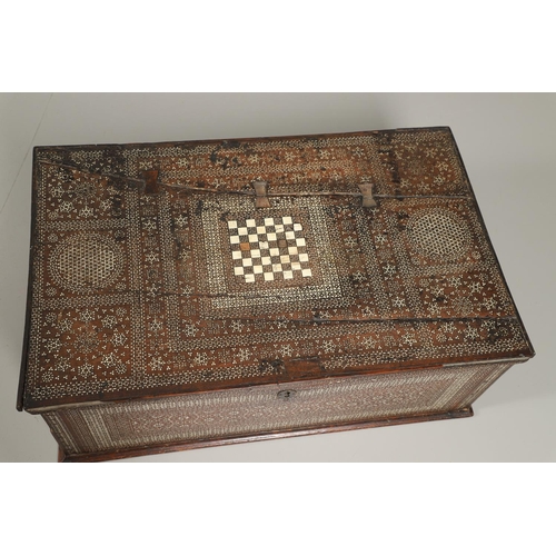 1563 - A NORTH AFRICAN BONE INLAID HARDWOOD TRAVELLING CHEST. circa 1800, profusely inlaid with bone diamon... 