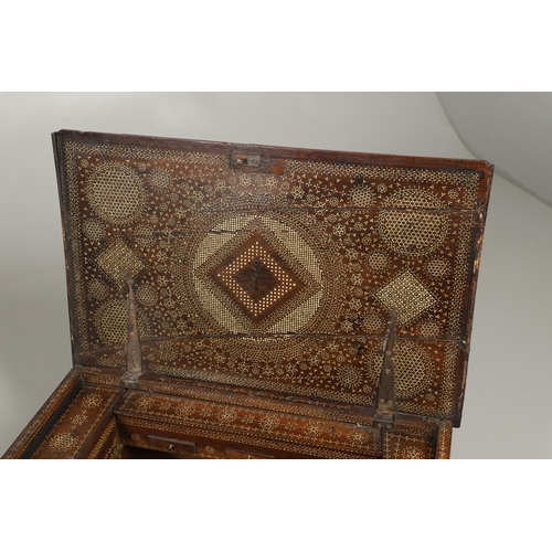 1563 - A NORTH AFRICAN BONE INLAID HARDWOOD TRAVELLING CHEST. circa 1800, profusely inlaid with bone diamon... 