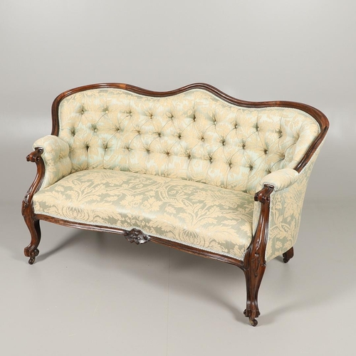 1568 - A ROSEWOOD SHOW FRAME BUTTON BACK TWO SEATER SOFA. 19th century, the wavy frame on carved scroll arm... 