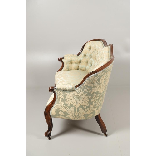 1568 - A ROSEWOOD SHOW FRAME BUTTON BACK TWO SEATER SOFA. 19th century, the wavy frame on carved scroll arm... 