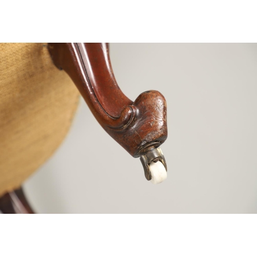 1569 - A PAIR OF MAHOGANY SHOW FRAME BUTTON BACK ARMCHAIRS. 19th century, the scroll and flower carved fram... 