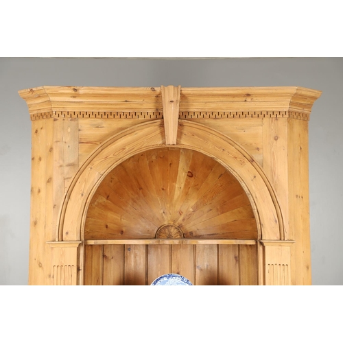 1572 - A PINE BARREL BACK ALCOVE CUPBOARD. the upper section with Classical architectural features to three... 