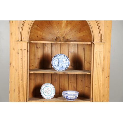 1572 - A PINE BARREL BACK ALCOVE CUPBOARD. the upper section with Classical architectural features to three... 