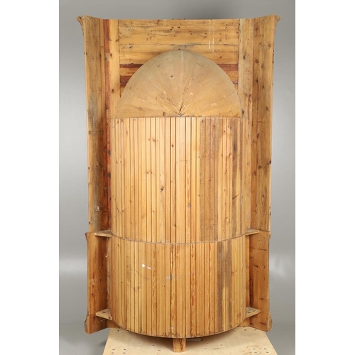 1572 - A PINE BARREL BACK ALCOVE CUPBOARD. the upper section with Classical architectural features to three... 