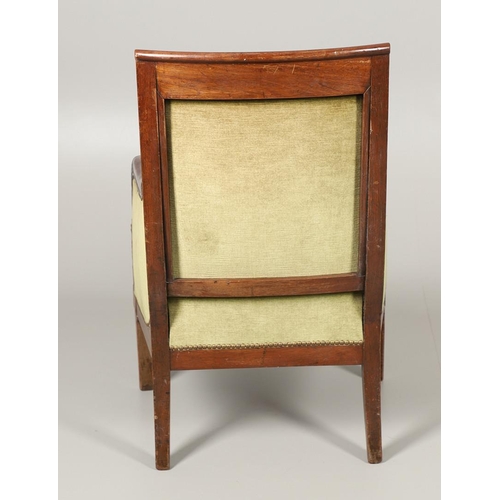 1575 - A FRENCH EMPIRE MAHOGANY ARMCHAIR, CIRCA 1830. the carved frame with anthemion decoration on swept l... 