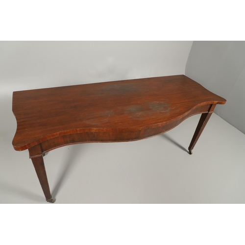 1576 - A 19TH CENTURY MAHOGANY SERPENTINE SERVING TABLE. the shaped top on square tapering legs and brass c... 