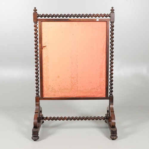 1581 - A 19TH CENTURY ROSEWOOD FIRESCREEN. the glazed needlework panel depicting a flowering urn on a barle... 