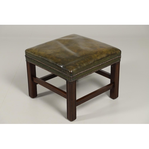 1582 - A GREEN LEATHER FOOT STOOL. of square form, with studded green leather upholstery and square section... 