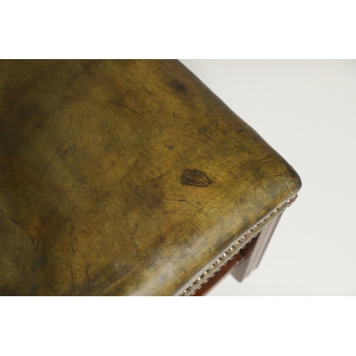 1582 - A GREEN LEATHER FOOT STOOL. of square form, with studded green leather upholstery and square section... 