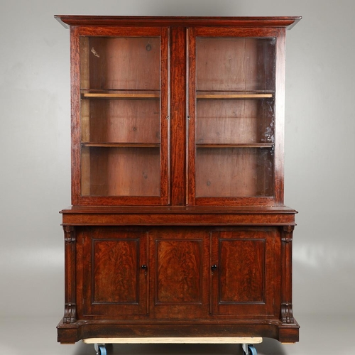 1583 - A LATE 19TH CENTURY MAHOGANY LIBRARY BOOKCASE. the glazed upper half enclosing four adjustable shelv... 