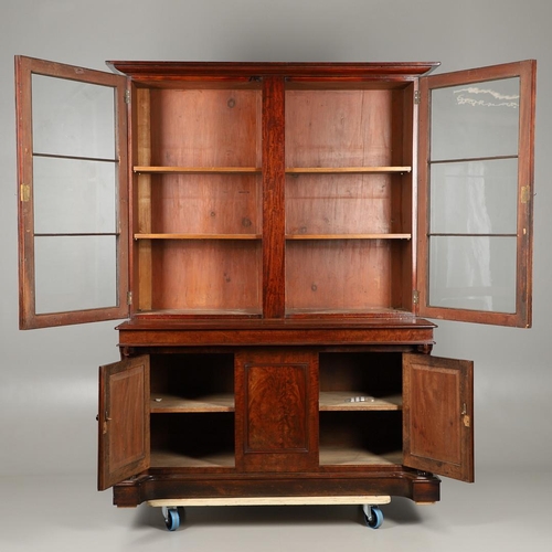 1583 - A LATE 19TH CENTURY MAHOGANY LIBRARY BOOKCASE. the glazed upper half enclosing four adjustable shelv... 