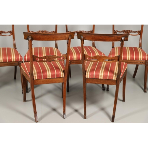 1585 - A SET OF EIGHT REGENCY MAHOGANY DINING CHAIRS. the curving crest rails to a carved frame with scroll... 