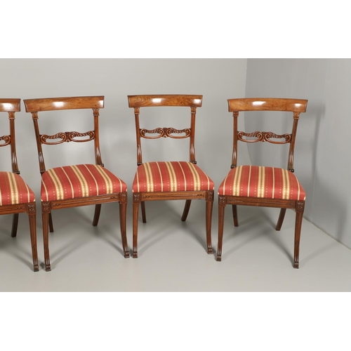 1585 - A SET OF EIGHT REGENCY MAHOGANY DINING CHAIRS. the curving crest rails to a carved frame with scroll... 