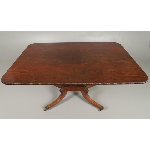 1586 - A REGENCY MAHOGANY TILT TOP BREAKFAST TABLE. the rectangular top with beaded moulded edge upon a car... 