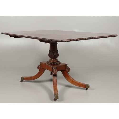 1586 - A REGENCY MAHOGANY TILT TOP BREAKFAST TABLE. the rectangular top with beaded moulded edge upon a car... 