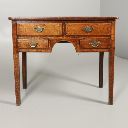 1587 - AN 18TH CENTURY OAK LOWBOY. the four drawers over an arched apron and square chamfered legs, height ... 