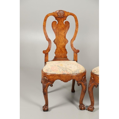 1588 - A PAIR OF GEORGE I STYLE WALNUT DINING CHAIRS. the backs with vase shaped splats above drop-in needl... 