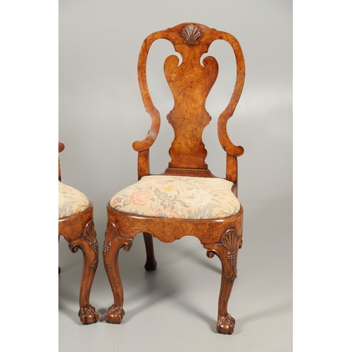 1588 - A PAIR OF GEORGE I STYLE WALNUT DINING CHAIRS. the backs with vase shaped splats above drop-in needl... 