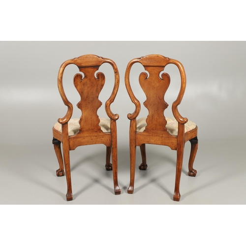 1588 - A PAIR OF GEORGE I STYLE WALNUT DINING CHAIRS. the backs with vase shaped splats above drop-in needl... 