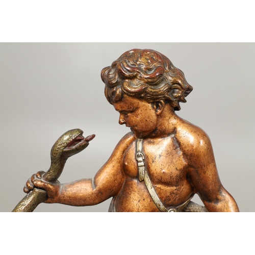 1595 - A PAINTED CAST IRON UMBRELLA/STICK STAND. 19th century, modelled as a semi-clad boy fighting a snake... 