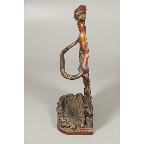 1595 - A PAINTED CAST IRON UMBRELLA/STICK STAND. 19th century, modelled as a semi-clad boy fighting a snake... 