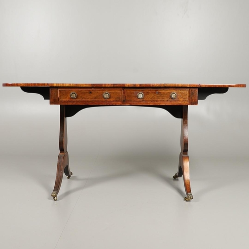 1597 - A REGENCY MAHOGANY AND SATINWOOD STRUNG SOFA TABLE. the crossbanded top over two drawers and opposin... 