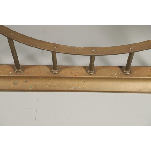 1598 - AN EARLY 20TH CENTURY BRASS AND LEATHER CLUB FENDER. with studded green leather seats upon cylindric... 